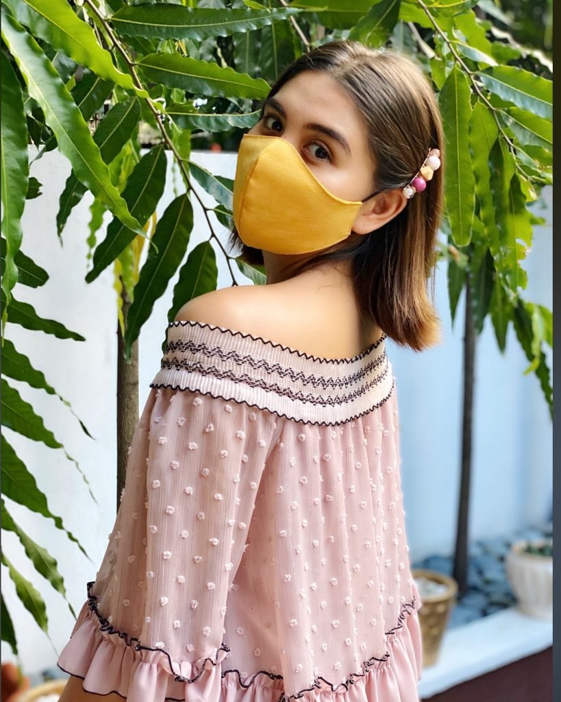 Ashley wears fashionable mask