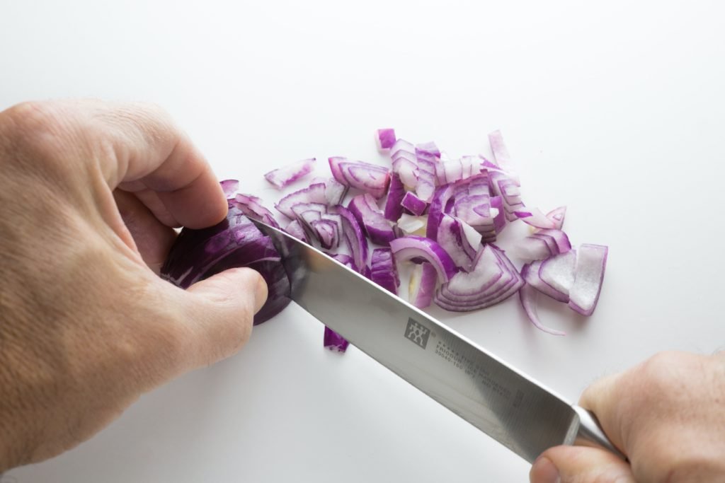 Using a sharp kitchen knife reduces the chances of you crying while chopping an onion.