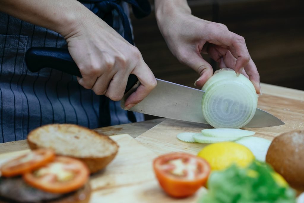 Using a sharp kitchen knife is efficient, faster, and safer.