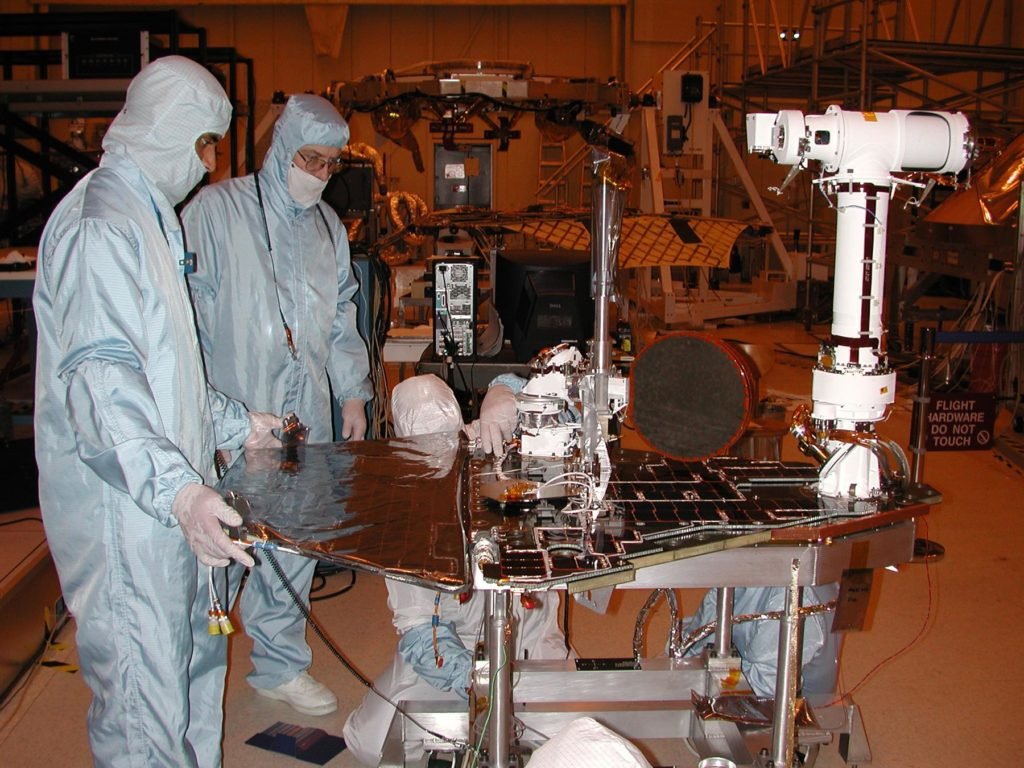 NASA personnel completing the assembly and testing of MER. Photo Credit: NASA