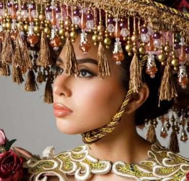 Beatriz McLelland shields through her Salakot National Costume