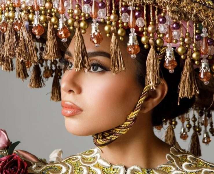 Beatriz McLelland shields through her Salakot National Costume