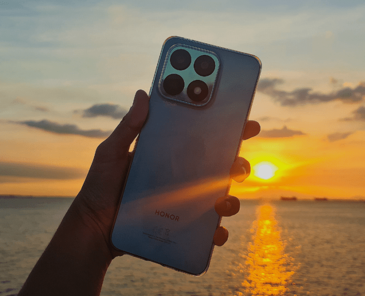 Honor X8a Cyan Lake Phone featuring sunset