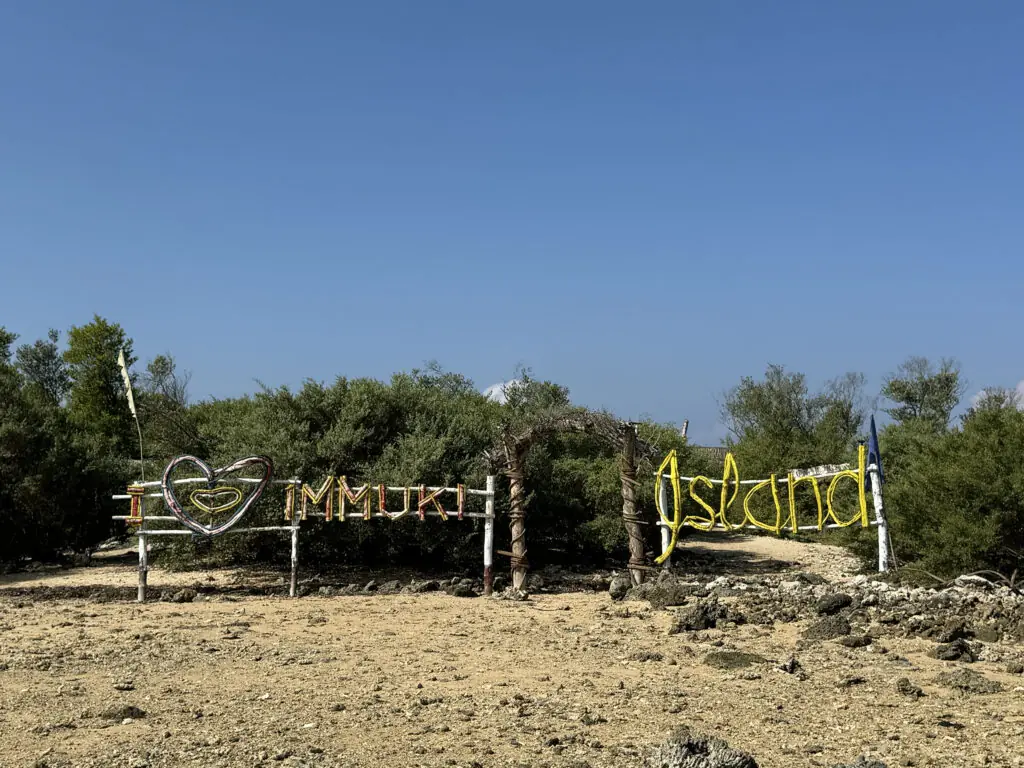A picture perfect name of Immuki Island in La Union with trees as backdrop.
